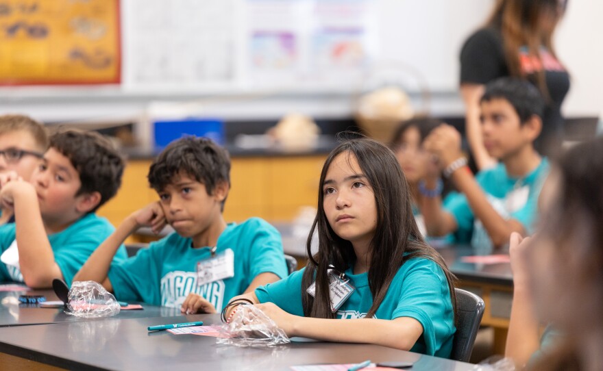 Students listen intently as they learn about continuing education.