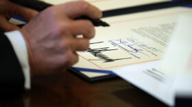 President Trump signs sweeping tax reform legislation into law in the Oval Office at the White House, Dec. 22, 2017 in Washington, D.C. (Chip Somodevilla/Getty Images)
