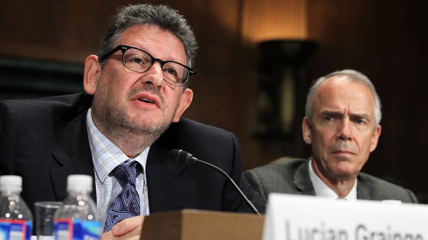 Chairman and CEO of Universal Music Group Lucian Grainge (left) and Roger Faxon, the CEO of EMI Group, testify during a Senate Judiciary subcommittee hearing on Universal's proposed merger with EMI.