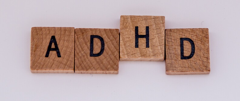 Wood tiles spell out ADHD.
