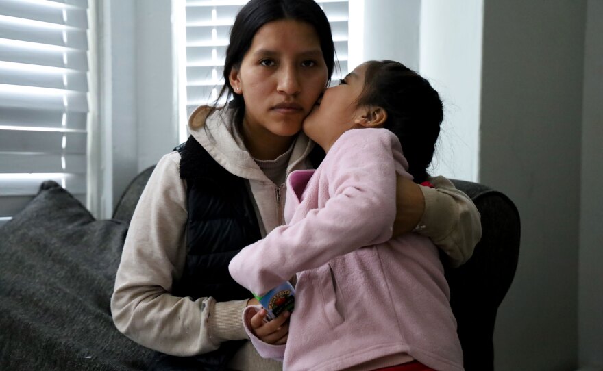 Camila gives her mother, Mayra Vaca Latacunga, a kiss on the cheek in Biddeford, Maine on Feb. 4, 2026. They are reunited after Latacunga was picked up by immigration agents in January. Their ability to remain in the U.S. is uncertain.