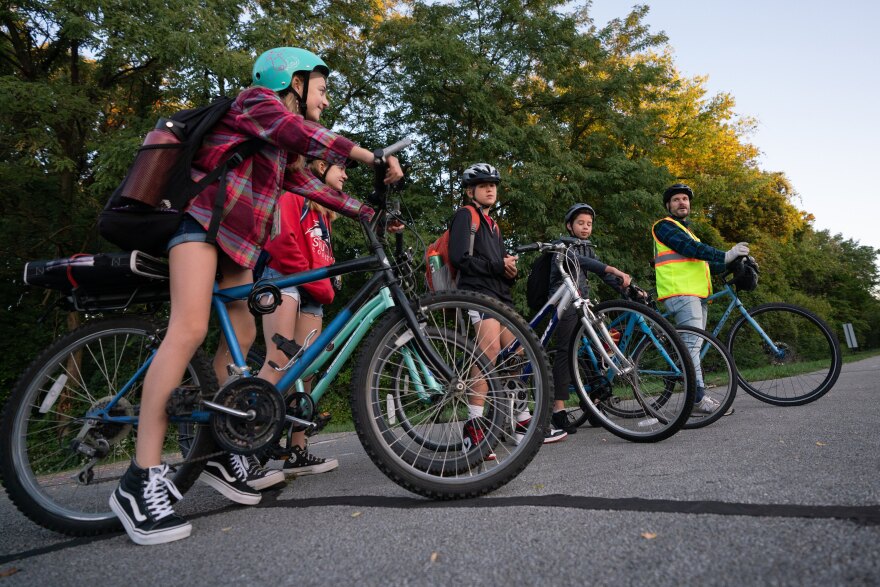 From left: Nathalie Manuel, Annabelle, Adam and Liam Catlin line up while Jeff Manuel leads the front during a morning bike train on Friday, Oct. 6, 2023, in Edwardsville, Ill.