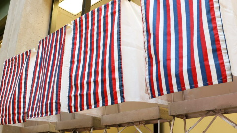 Voting booths stand in the State Office Building in Juneau on primary day, Aug. 18, 2026.