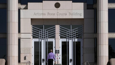 A man enters the Arizona Supreme Court building, Wednesday, April 10, 2024, in Phoenix.