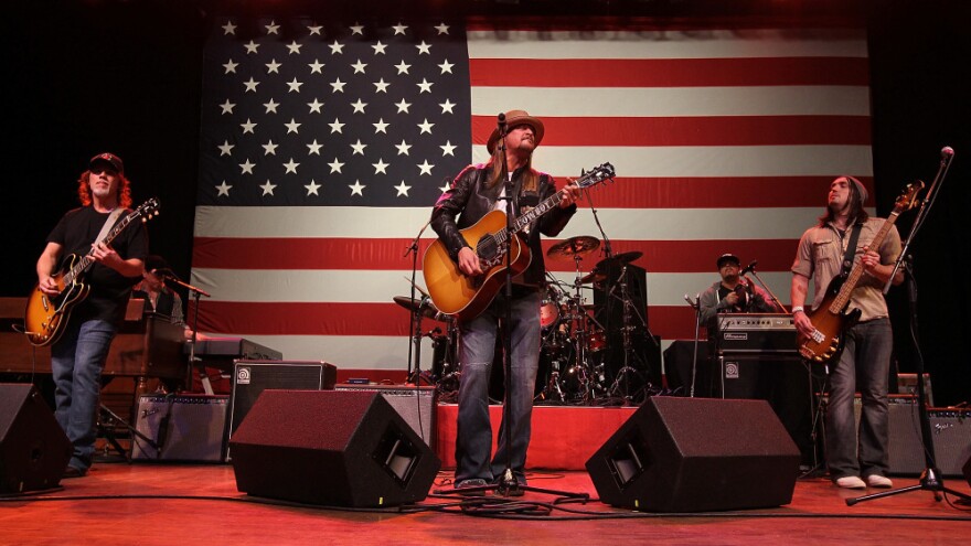 Kid Rock performs during a campaign rally for Republican presidential candidate Mitt Romney in Michigan Monday night. Romney asked for, and was given, permission to use the Detroit rocker's song "Born Free" in his campaign.
