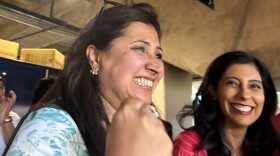 Farah Ali cheers on Portugal during the team's match against Spain at Dallas Stadium.