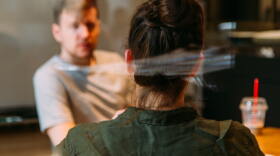 A man and woman talking at a business meeting