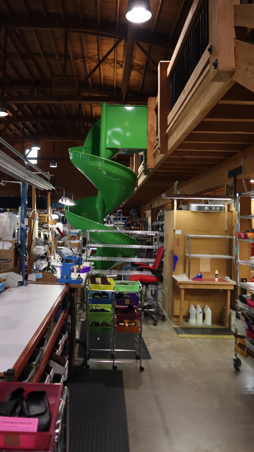 When going from the balcony office space to the factory floor at Softstar Shoes, one has the option of taking the stairs or the slide, as seen in this March 5, 2026 picture.