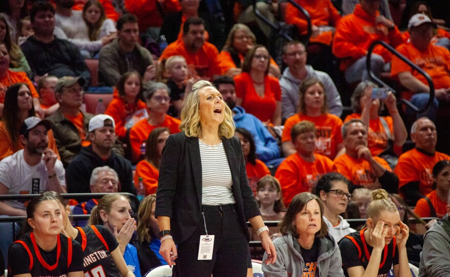 Girls high school basketball players inside an arena