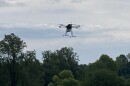 A drone equipped by NASA rises over UVA's Morven Farm.
