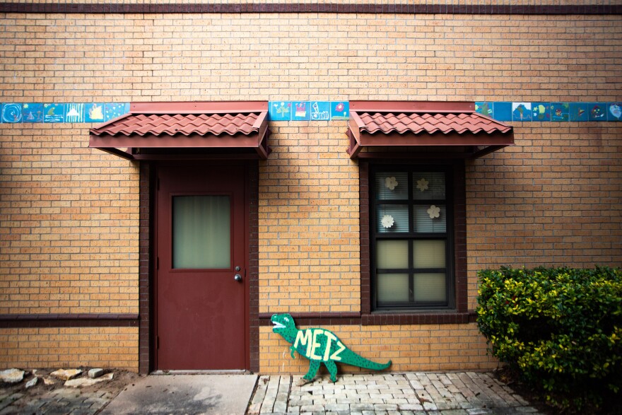 Exterior tiles painted by students of Metz Elementary School, set to close this year, in the Holly neighborhood of East Austin on Jan. 28, 2021. (Gabriel C. Pérez/KUT News)