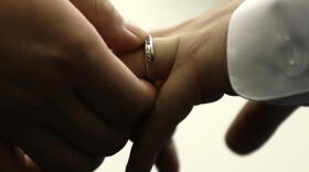 A couple exchanges wedding bands at City Hall in Philadelphia, Oct. 11, 2018. (Matt Rourke/AP)