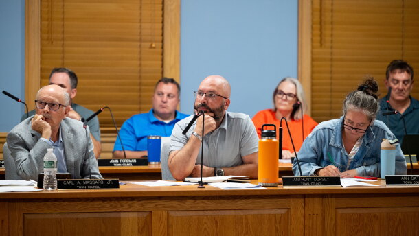 (L-R) Town Council members Carl Massaro, Anthony Dorsey, and Ann Sather listen as local residents give their testimonies on how they feel about the pre-existing data center moderinzing into an AI Data center at Trumbull town hall on September 9, 2026 in Trumbull, Connecticut.