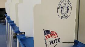 White dividers with an American flag and the Maricopa County seal on them