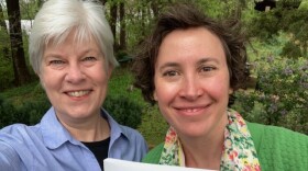 Kaye McIntyre, Megan Kaminski holding book