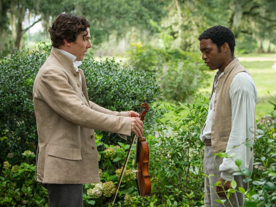 Chiwetel Ejiofor (right) plays Solomon Northup in <em>12 Years A Slave</em>. Benedict Cumberbatch plays one of the slaveowners who claim ownership of him.