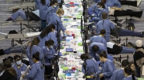 Patients receive dental care during the Seattle/King County Clinic on Thursday, October 26, 2017, at Key Arena in Seattle. 