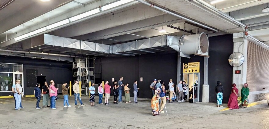 Kentuckians visiting the Bowling Green regional driver's license center waited in a line that snaked from the office to the the adjacent parking garage on Apr. 22, 2025.