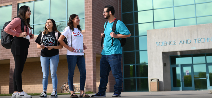 Students outside of the Science and Technology building on the campus of Southwest Indian Polytechnic Institute, Albuquerque.