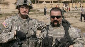 Brian Dennison (left) at a humanitarian aid drop in Rumadi, Iraq with a Kurdish interpreter. When he concluded his Army career, Dennison had achieved the rank of Captain.