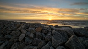 Sunset over the seawall in Shishmaref, Alaska. 