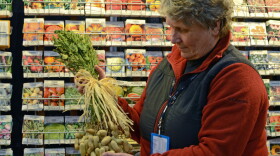 D. Landreth Seed Co. President Barbara Melera with a bunch of peanuts at her Philadelphia Flower Show booth.