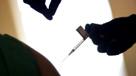FILE - In this Tuesday, Dec. 15, 2020 file photo, a droplet falls from a syringe after a health care worker is injected with the Pfizer-BioNTech COVID-19 vaccine at Women & Infants Hospital in Providence, R.I. The Vatican has declared it “morally acceptable” for Roman Catholics to receive COVID-19 vaccines based on research that used fetal tissue from abortions. he Vatican’s watchdog office for doctrinal orthodoxy said Monday that it addressed the question after receiving requests for guidance. (AP Photo/David Goldman, File)