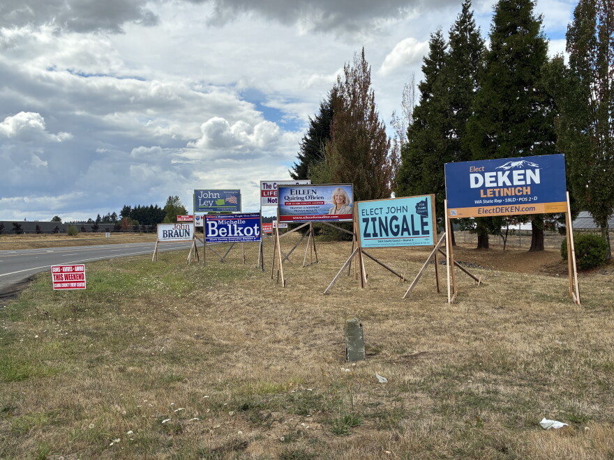 Election signs on the side of a highway entering the city of Battle Ground, WA.