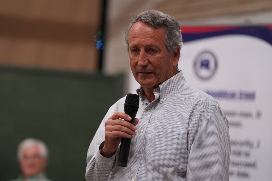 Mark Sanford, former congressman and South Carolina governor, speaks to voters he campaigns for his former U.S. House seat at a Dorchester County GOP event Thursday, April 9, 2026, in Summerville, S.C. (AP Photo/Meg Kinnard)