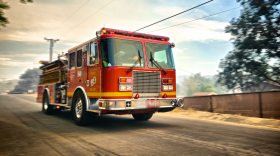 FILE - speeding fire truck