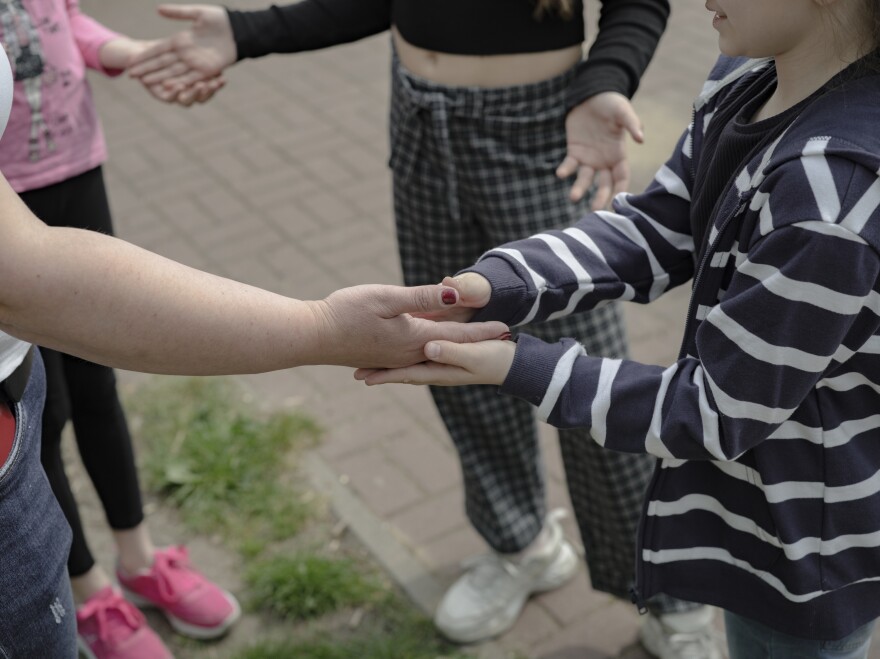 Ukrainian children play on the playground near Poland's Warsaw Ukrainian School.