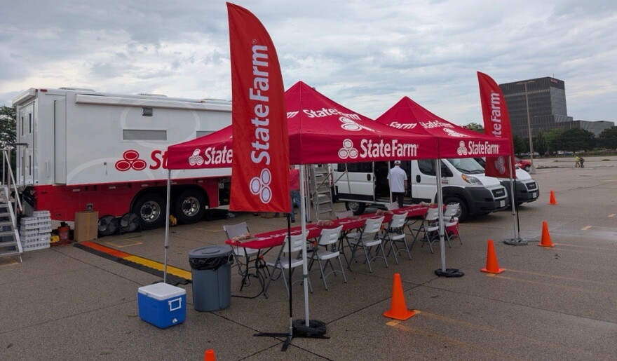 State Farm set up an operation in the parking lot of its headquarters Friday.