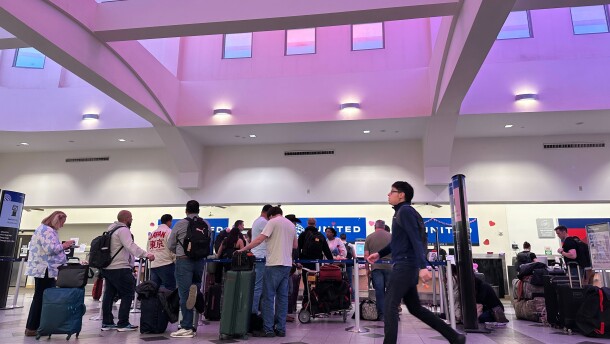 People stand in line at check-in counters at El Paso International Airport, Wednesday, Feb. 11, 2026, in El Paso, Texas.