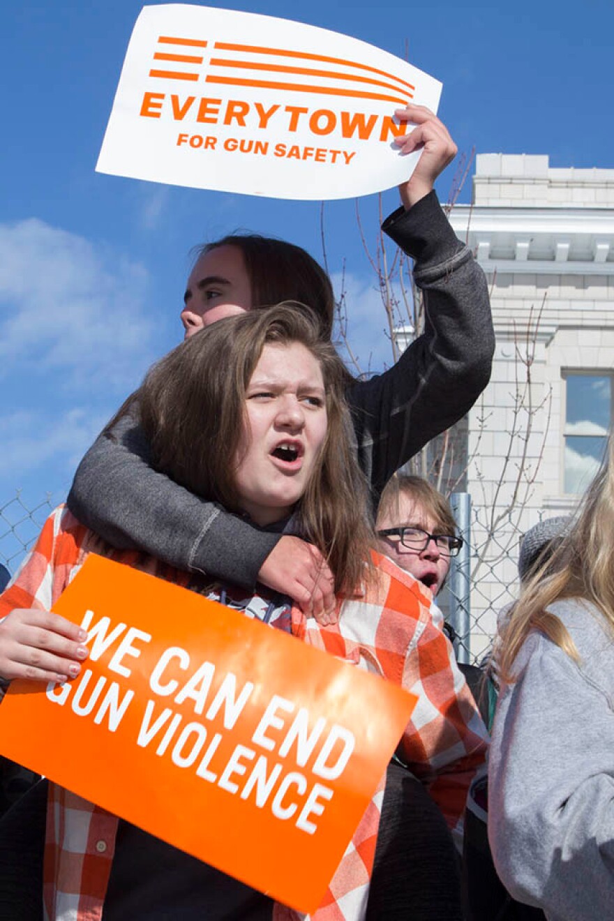 Missoula high school students hold signs calling for an end to gun violence. The students walked out of school February 21, 2018 to march.