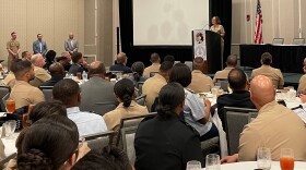 Chief Naval Officer, Adm. Lisa Franchetti speaks to a crowd of officers in Norfolk.
