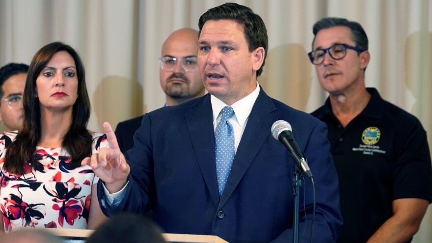 In this Tuesday, Aug. 10, 2021 file photo, Florida Governor Ron DeSantis answers questions related to school openings and the wearing of masks in Surfside.