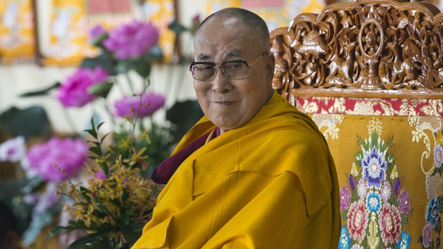 Tibetan spiritual leader the Dalai Lama sits on his ceremonial chair as he presides over the inauguration of the Namgyal Monastery School in Dharmsala, India on Nov. 2, 2017.