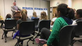 Students from West Lafayette's Cumberland and Happy Hollow Elementary Schools listen to Gov. Eric Holcomb lay out his priorities for 2018, which include taking up their cause of naming Say's Firefly Indiana's official state insect.