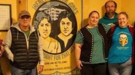 Descendants of Irene and Nettie Jones stand with artist Matt Hamilton in front of his installation at Schoenbar Middle School depicting the Jones women.