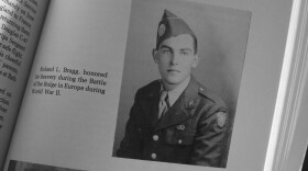 A military photo of Pfc. Roland L. Bragg is seen in a book about the history of Nobleboro, Maine, Feb. 11, 2025, in Nobleboro.