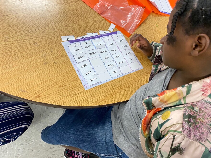 A Huntersville Elementary student works on a reading lesson.