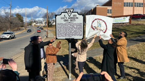 Roanoke school officials and community members unveil a state highway historical marker recognizing Lucy Addison.