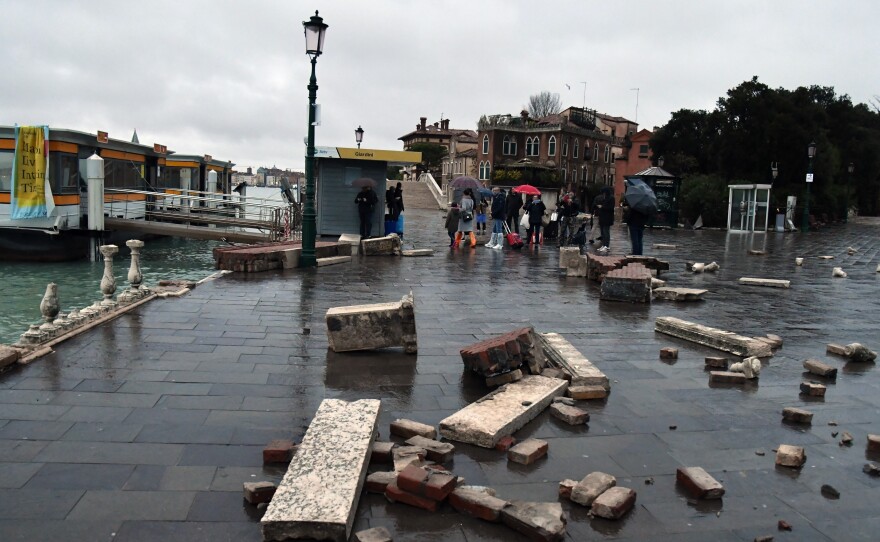 A dock, partially flooded, lies damaged in Venice on Wednesday.