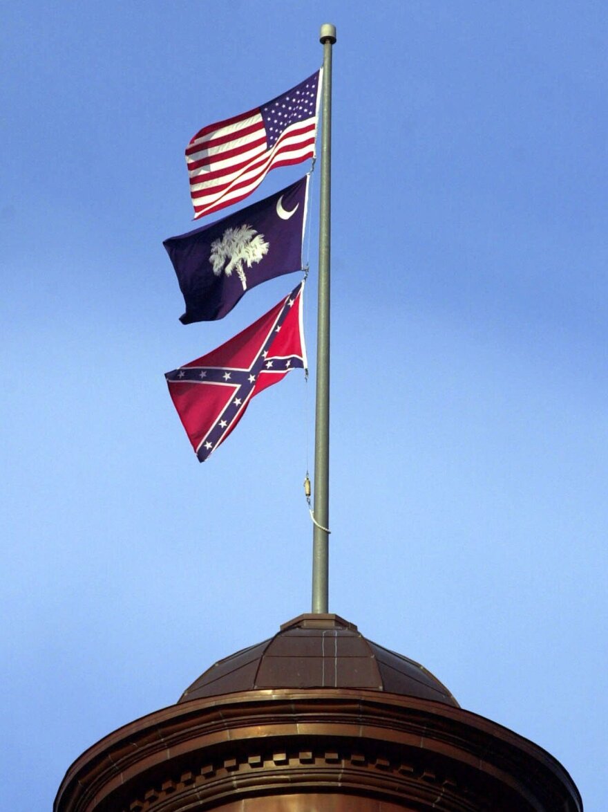 The Confederate flag flies on the dome of the Statehouse in Columbia, S.C., in 2000.