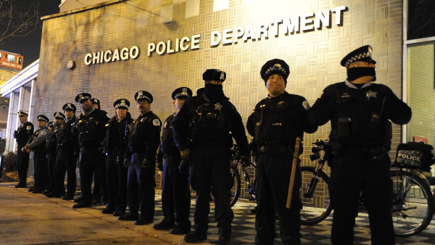 Chicago police officers line up outside the District 1 central headquarters during a protest of the police shooting of 17-year-old Laquan McDonald. The shooting death became a rallying cry for activists calling for police reform.