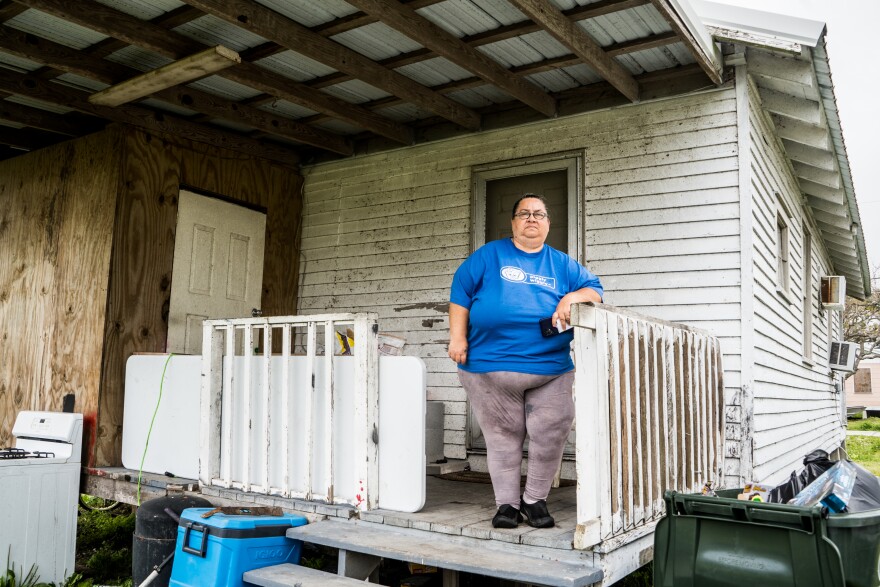 Margorie Rodrigue stands outside of her rental in Chauvin in March 2022.