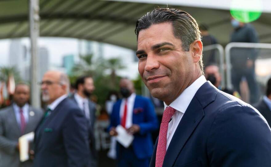 Miami Mayor Francis Suarez greets guests before being inaugurated as the 80th President of the U.S. Conference of Mayors at the Maurice A. Ferré Park in downtown Miami, Florida on Monday, January 3, 2022.