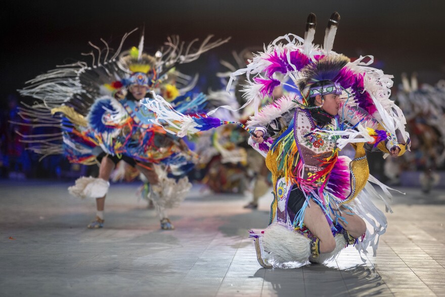 Thirteen-year-old Leland Mitsuing, right, of Saskatchewan, Canada competes in the Jr. Boys Traditional competition at the 40th anniversary of the Gathering of Nations Pow Wow in Albuquerque, N.M., April 28, 2023.