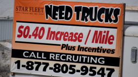 A sign from a trucking company in Nappanee, Indiana, recruits truckers. In some industries, like trucking, worker shortages were exacerbated by the pandemic.