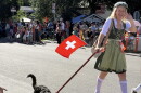A Midway Swiss Days parade participant with a dog. The proposed application changes would allow event organizers to indicate whether they'd like to include animals in their town square festivities. 